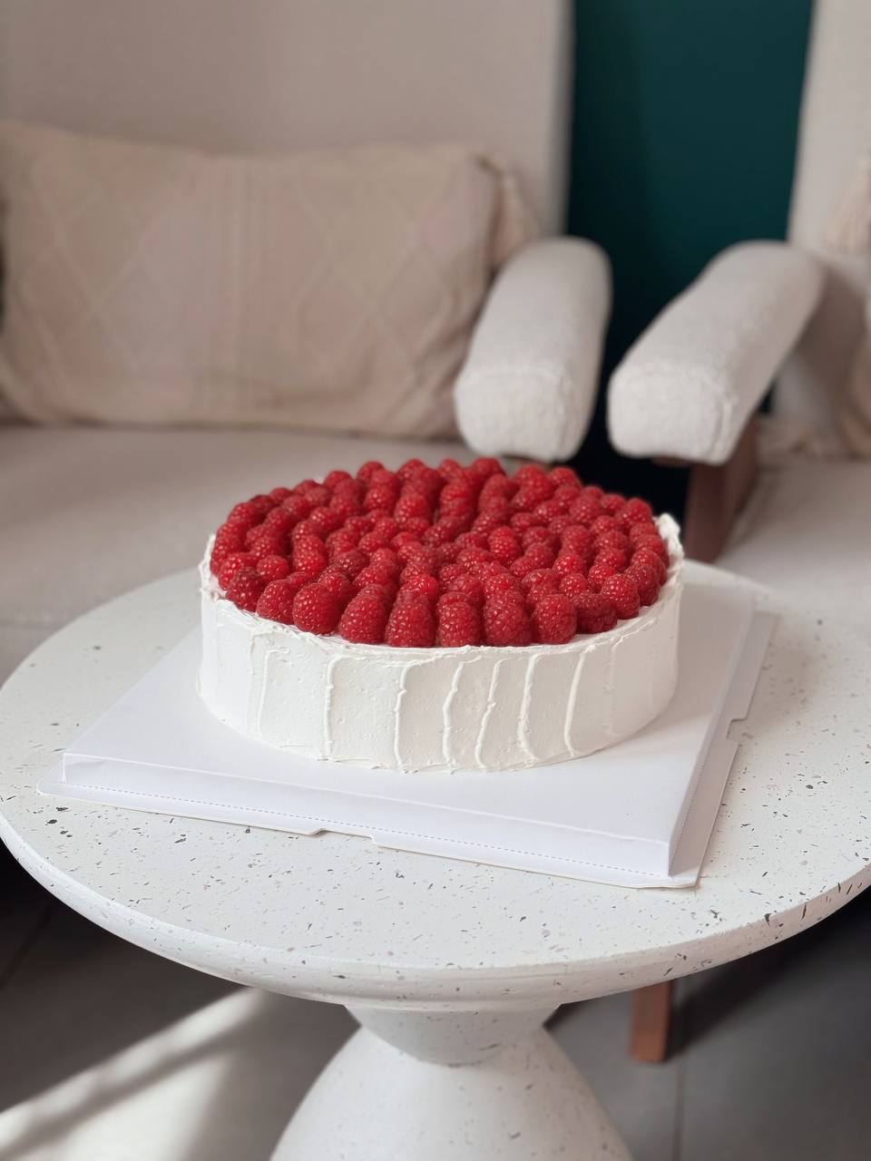 low cake with raspberries